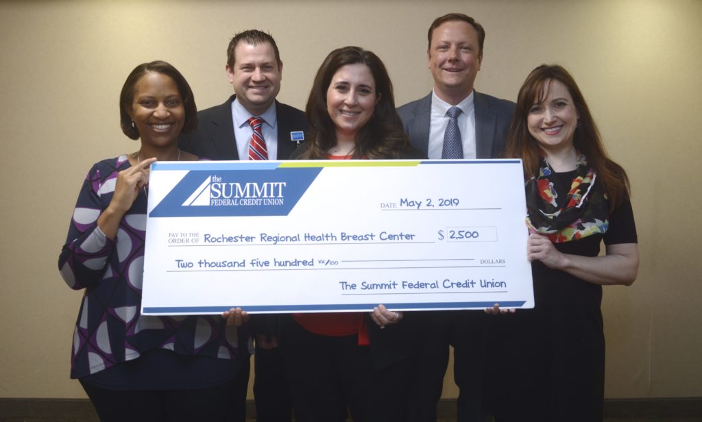 The Summit and Rochester Regional Breast Center with large check.