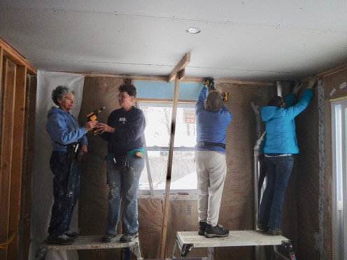 Volunteers help build a Habitat for Humanity home.