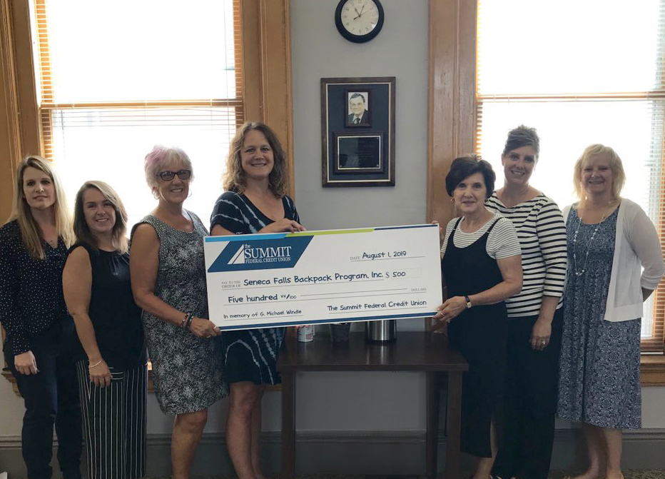 The Summit FCU Presents Check to Seneca Falls Backpack Program