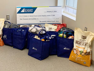 Check and bags of dog food for Second Chance Canine Adoption Center