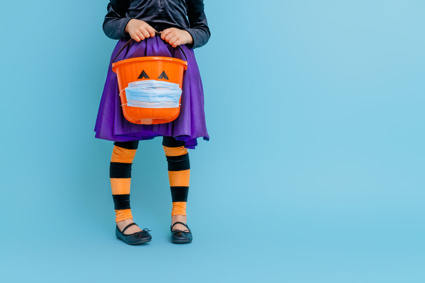 kid with halloween basket