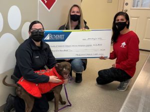 Syracuse Law Enforcement joined The Summit Federal Credit Union to present a donation to the Friends of the Second Chance Canine Adoption Center.