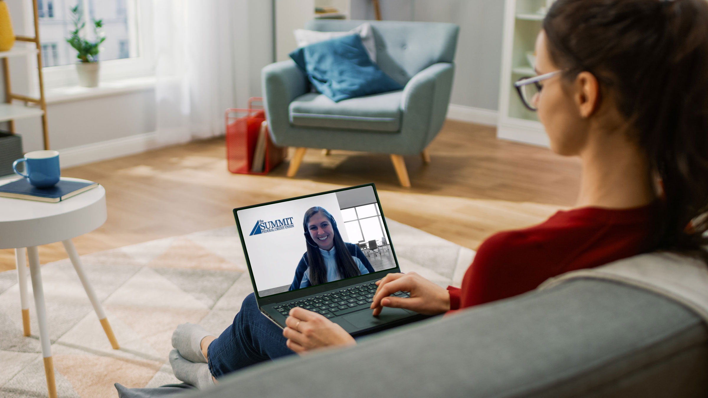  Woman having virtual branch zoom call 